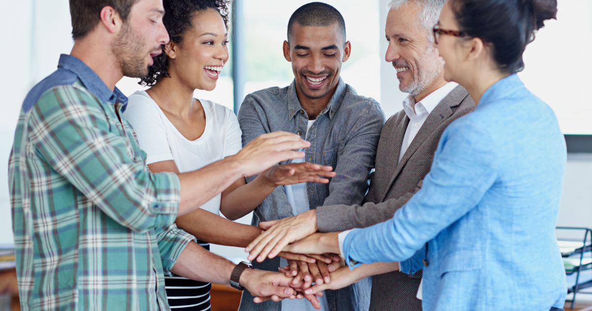 A team of young people with their mentor supporting each other